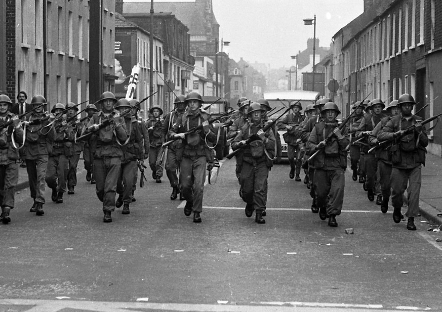 British Army troops patrol the streets after being deployed to end the Battle of the Bogside, Derry, Northern Ireland, mid to late August 1969. The conflict, beginning on August 12 and ending on Augus ...