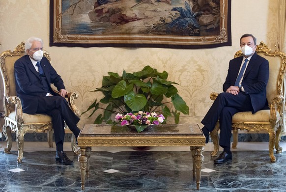 epa08983820 A handout photo made available by the press office of the Quirinal Palace (Palazzo Quirinale) shows former president of the European Central Bank (ECB) Mario Draghi meeting Italian Preside ...