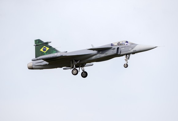 epa07832851 A Saab Gripen E fighter is flown by a test pilot as the first Saab Gripen E fighter was handed over to Brazil during a ceremony at Saab in Linkoping, Sweden, 10 September 2019. Brazil has  ...