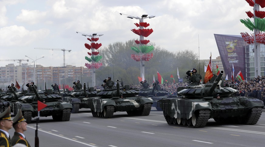 A column of Belarus Army tanks drive during the Victory Day military parade that marked the 75th anniversary of the allied victory over Nazi Germany, in Minsk, Belarus, Saturday, May 9, 2020. Belarus  ...