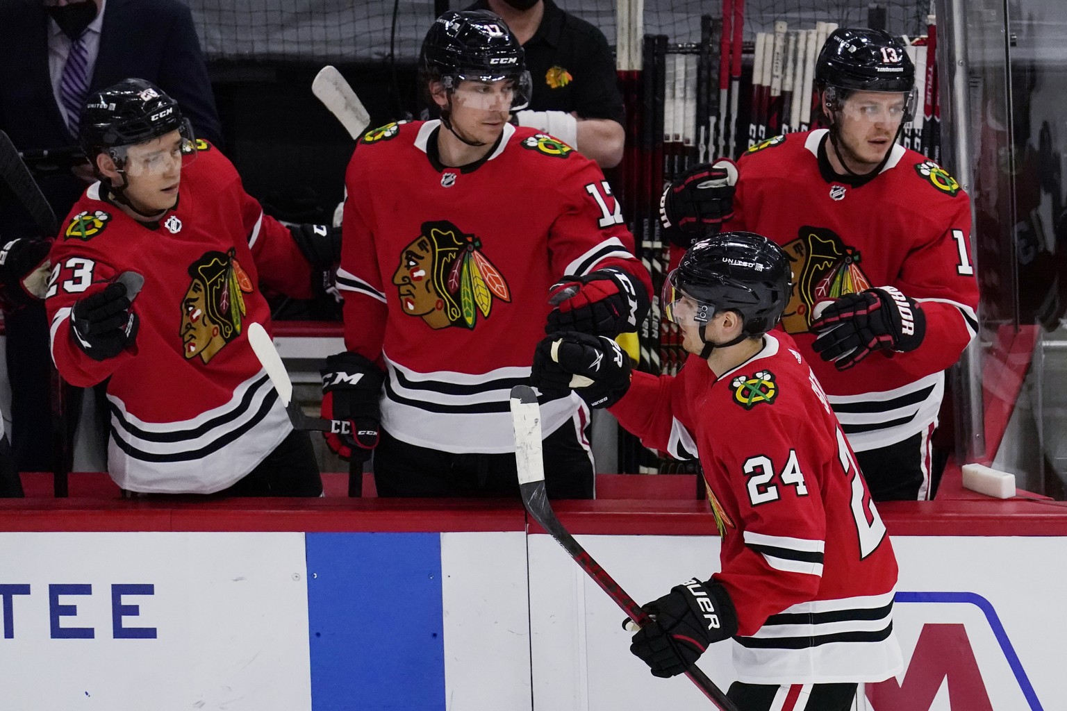 Chicago Blackhawks center Pius Suter (24) celebrates with teammates after scoring a goal against the Florida Panthers during the second period of an NHL hockey game in Chicago, Thursday, March 25, 202 ...