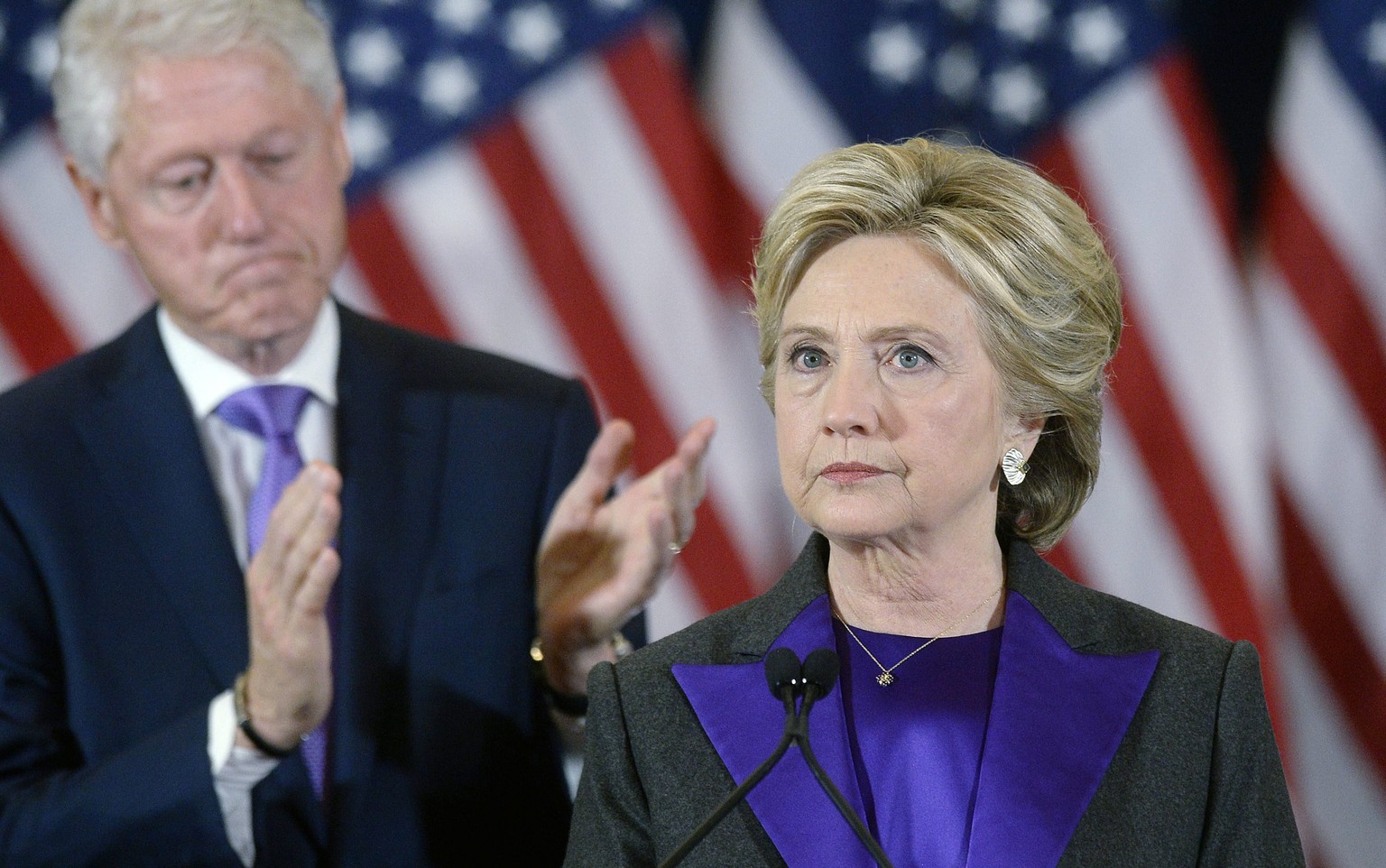 epa05624569 Democractic presidential candidate Hillary Clinton (R) delivers her concession speech next to her husband former US president Bill Clinton (L), at the New Yorker Hotel&#039;s Grand Ballroo ...