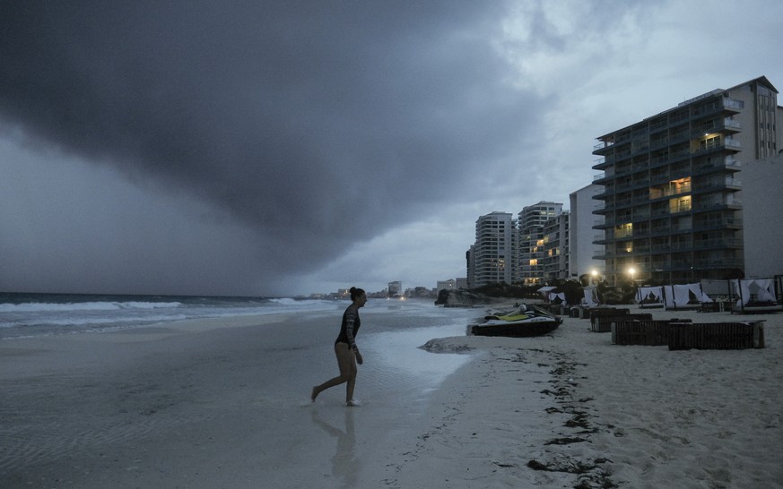 Clouds gather over Playa Gaviota Azul as Tropical Storm Zeta approaches Cancun, Mexico, Monday, Oct. 26, 2020. A strengthening Tropical Storm Zeta is expected to become a hurricane Monday as it heads  ...