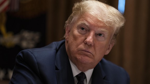 President Donald Trump listens during a meeting on opportunity zones in the Cabinet Room of the White House, Monday, May 18, 2020, in Washington. (AP Photo/Evan Vucci)
Donald Trump