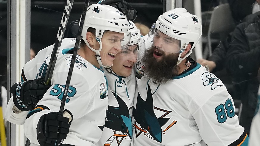 San Jose Sharks center Lukas Radil (52) is congratulated by teammates Timo Meier, center, and San Jose Sharks defenseman Brent Burns (88) after scoring a goal against the Los Angeles Kings during the  ...