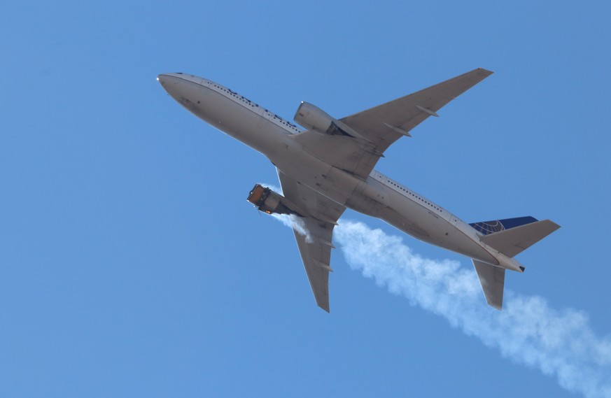 epa09028737 A photo provided by Instagram user Hayden Smith (speedbird5280) shows United Airlines flight 328 (Boeing 777-200, tailnumber N772UA) with an engine on fire, near Denver, Colorado, USA, 20  ...