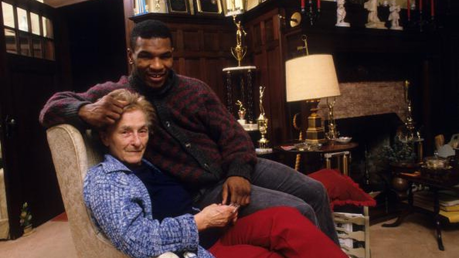 Boxing: Portrait of Mike Tyson with his surrogate mother, Camille Ewald, during photo shoot in her house.
Catskill, NY 12/1/1985
CREDIT: Manny Millan (Photo by Manny Millan /Sports Illustrated via Get ...