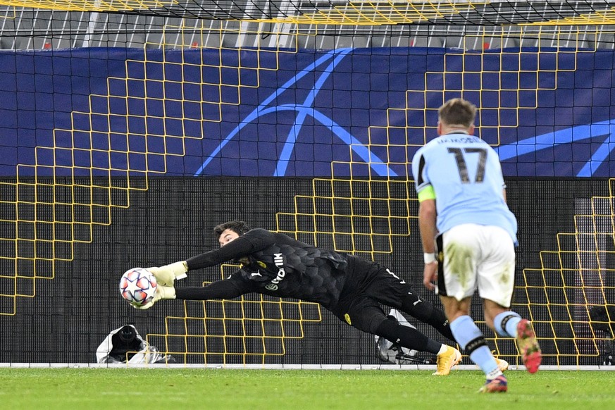 Dortmund&#039;s goalkeeper Roman Buerki makes a save in front Lazio&#039;s Ciro Immobile during the Champions League, Group F, soccer match between Borussia Dortmund and Lazio at the Signal Iduna Park ...