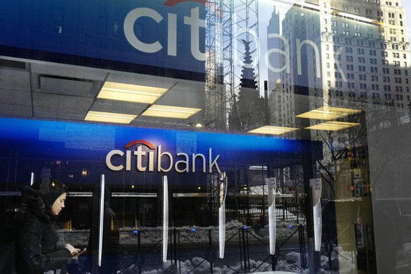 FILE - In this March 16, 2017, file photo, a customer enters a Citibank branch, in New York. Citigroup reports earnings Friday, Oct. 12, 2018. (AP Photo/Mark Lennihan, File)