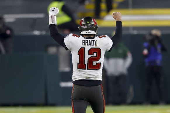 Tampa Bay Buccaneers quarterback Tom Brady reacts after winning the NFC championship NFL football game against the Green Bay Packers in Green Bay, Wis., Sunday, Jan. 24, 2021. The Buccaneers defeated  ...