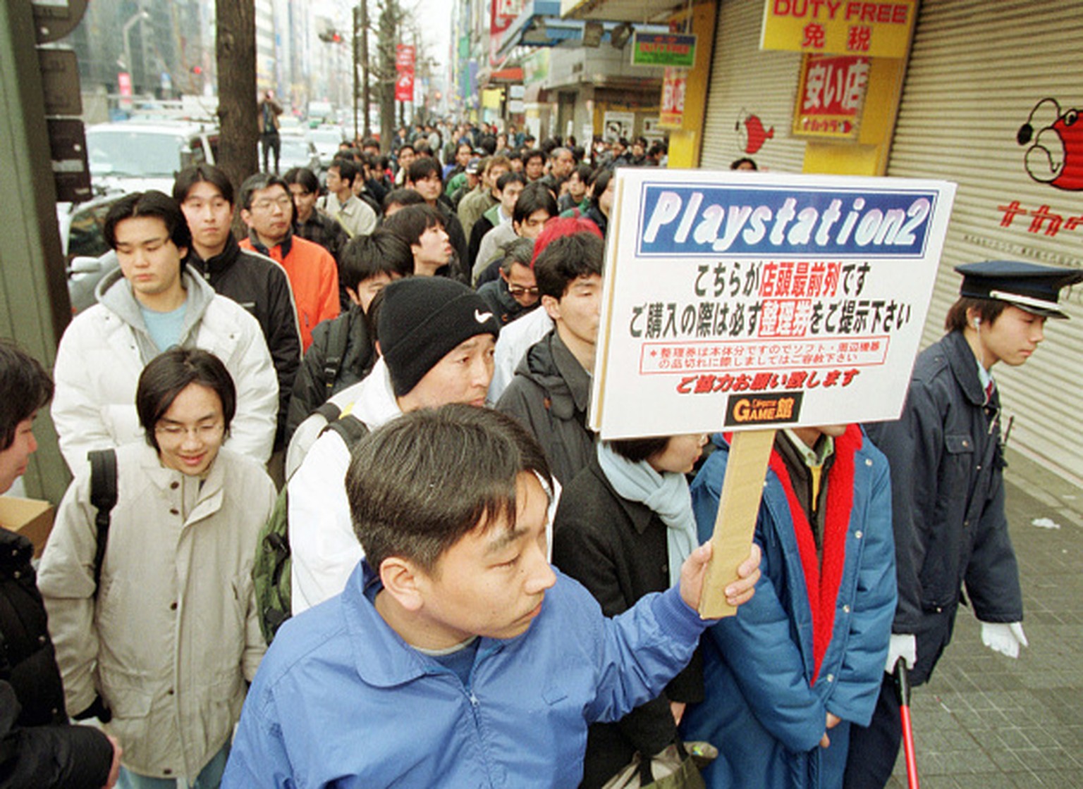 (Original Caption) Almost 5000 Japanese Playstation fans waiting for the video game shops to open in Akihabara quarter. (Photo by noboru hashimoto/Corbis via Getty Images)