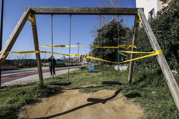 epa08316426 Local police tapes close the area of a playground located along the Monte Mario cycle path, following the decision of the Italian authorities to close schools and urge people to work from  ...