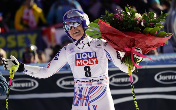 United States&#039; Lindsey Vonn holds a bunch of flowers she was given after completing an alpine ski, women&#039;s World Cup super-G in Cortina D&#039;Ampezzo, Italy, Sunday, Jan. 20, 2019. (AP Phot ...