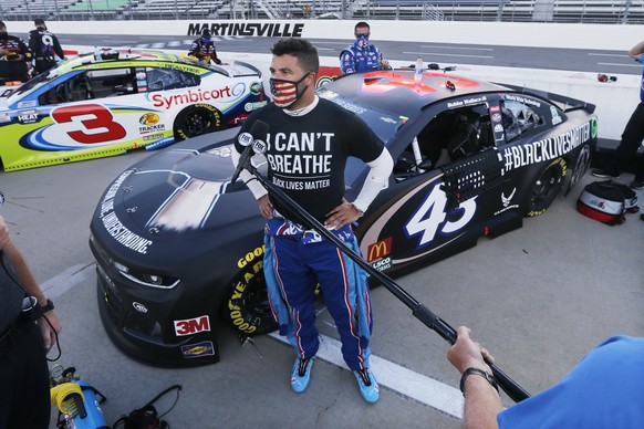 Driver Bubba Wallace is interviewed before a NASCAR Cup Series auto race Wednesday, June 10, 2020, in Martinsville, Va. (AP Photo/Steve Helber)
Bubba Wallace