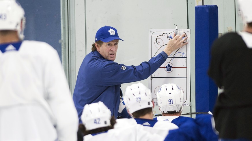 Toronto Maple Leafs NHL hockey head coach Mike Babcock, center, runs drills during practice in Toronto, Monday, April 8, 2019. The Maple Leafs take on the Boston Bruins in the first round of the Stanl ...