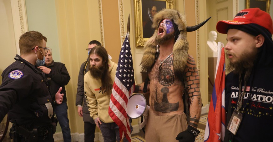 WASHINGTON, DC - JANUARY 06: Protesters interact with Capitol Police inside the U.S. Capitol Building on January 06, 2021 in Washington, DC. Congress held a joint session today to ratify President-ele ...