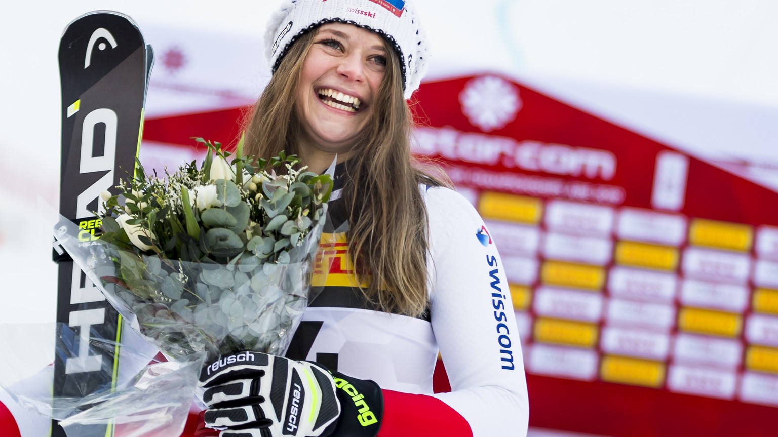 Corinne Suter of Switzerland, bronze medal, celebrates during the flowers cereemony after the women Super-G race at the 2019 FIS Alpine Skiing World Championships in Are, Sweden Tuesday, February 5, 2 ...