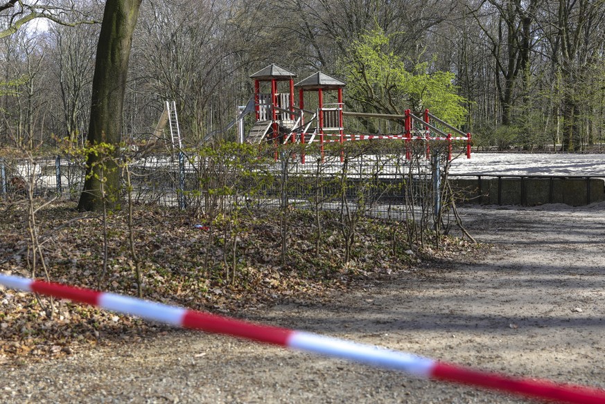 epa08341942 Police tape blocks the way to a playground at Tiergarten park in Berlin, Germany, 03 April 2020. The German government and local authorities are heightening measures to stem the spread of  ...