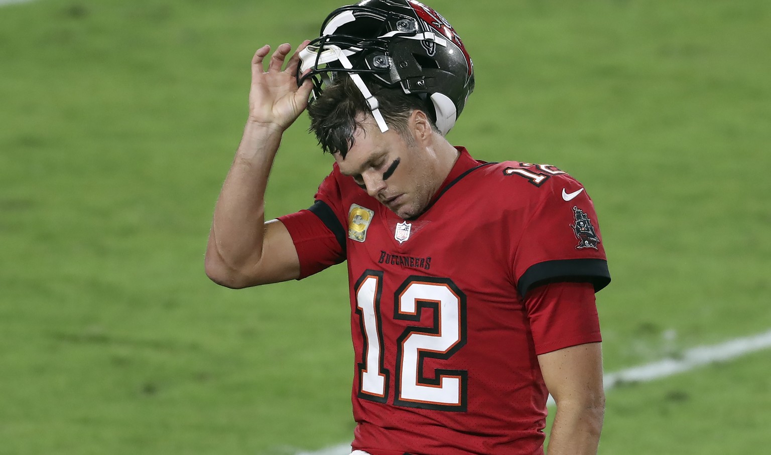 Tampa Bay Buccaneers quarterback Tom Brady (12) reacts as he leaves the field after throwing an interception against the New Orleans Saints during the second half of an NFL football game Sunday, Nov.  ...