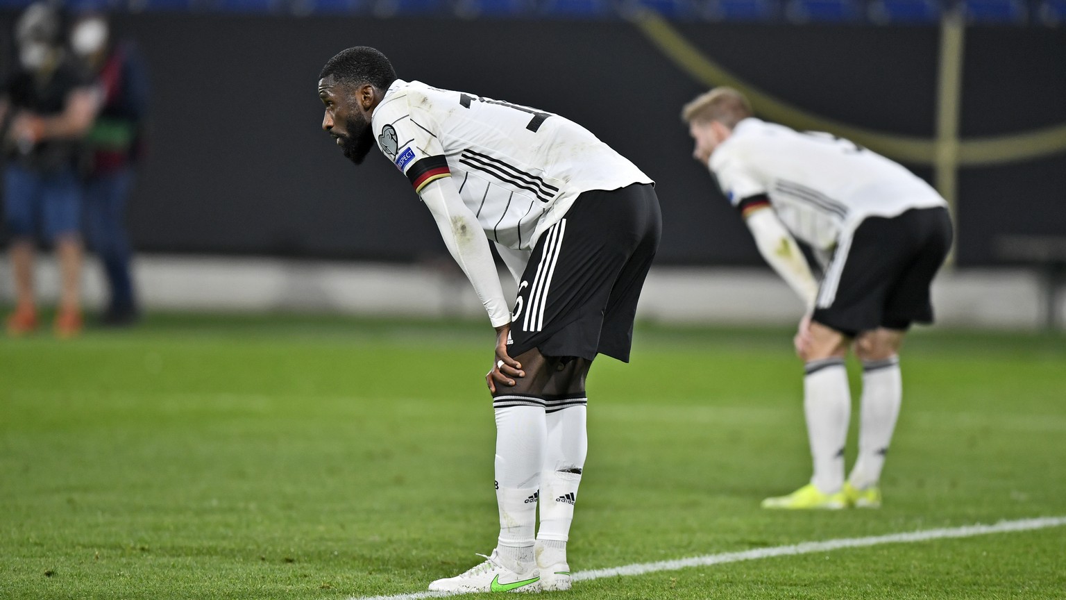 Germany&#039;s Antonio Ruediger stands on the pitch disappointed after losing the World Cup 2022 group J qualifying soccer match between Germany and North Macedonia in Duisburg, Germany, Wednesday, Ma ...