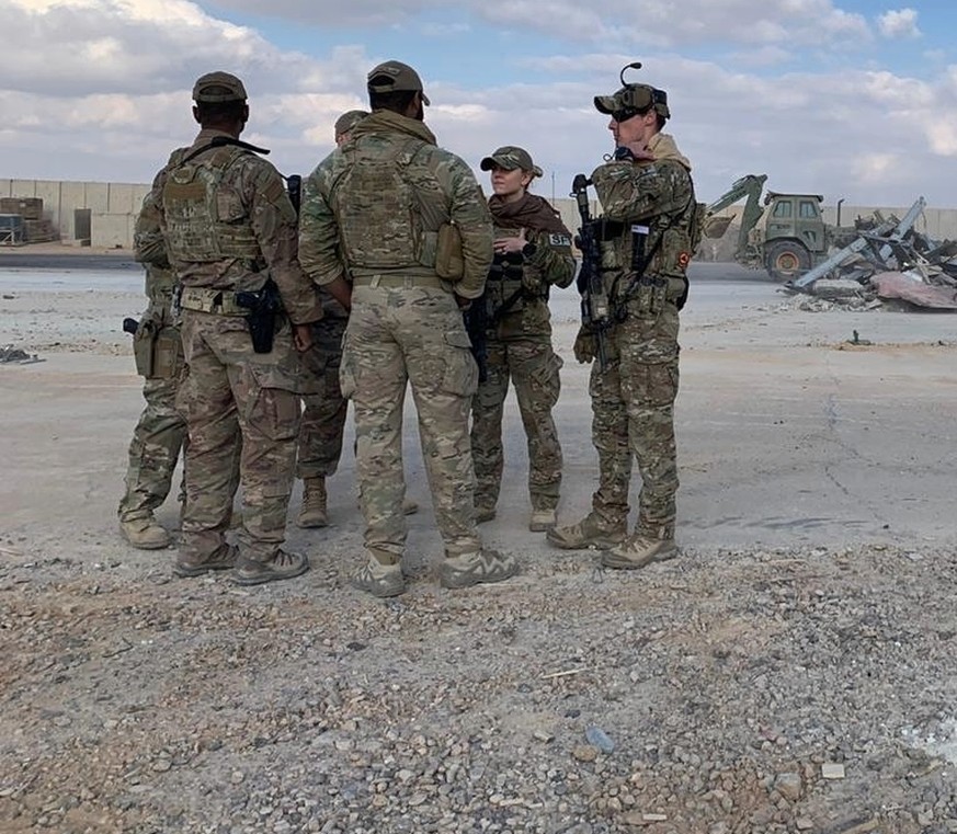 U.S. Soldiers stand while bulldozers clear rubble and debris at Ain al-Asad air base in Anbar, Iraq, Monday, Jan. 13, 2020. Ain al-Asad air base was struck by a barrage of Iranian missiles on Wednesda ...