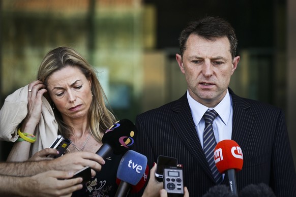 epa08463382 (FILE) Gerry McCann (R) and Kate McCann (L) the parents of the missing British child Madeleine talk to the press after a court session for the libel case against former Portuguese police c ...