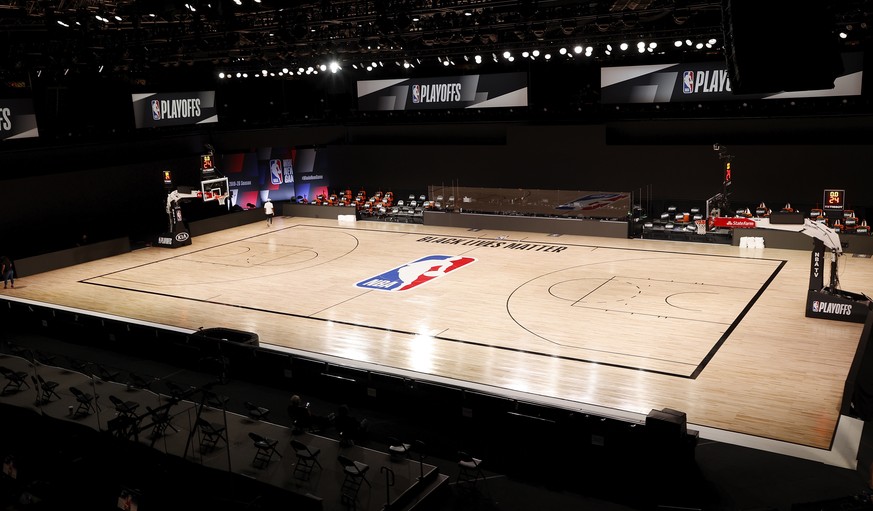 epa08627753 The court remains empty inside the AdventHealth Arena at the ESPN Wide World of Sports Complex in Kissimmee, Florida, USA, 26 August 2020. According to media reports the Milwaukee Bucks di ...