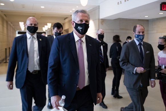 epa09193972 Republican House Minority Leader Kevin McCarthy (C) leaves after a vote to remove Liz Cheney&#039;s House GOP Conference Chair position in the US Capitol in Washington, DC, USA, 12 May 202 ...