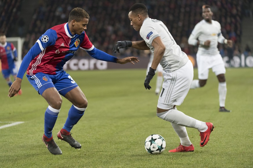 Basel&#039;s Manuel Akanji, left, fights for the ball against Manchester United&#039;s Anthony Martial, right, during the UEFA Champions League Group stage Group A matchday 5 soccer match between Swit ...
