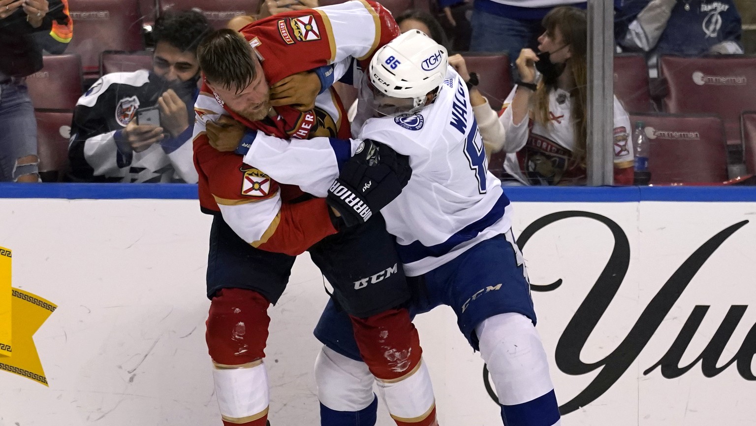 Florida Panthers defenseman Kevin Connauton, left, and Tampa Bay Lightning defenseman Daniel Walcott (85) fight during the second period of an NHL hockey game, Monday, May 10, 2021, in Sunrise, Fla. ( ...