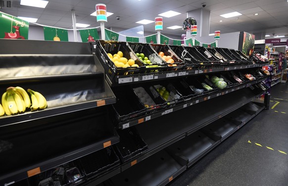 epa08898123 Supermarket shelves are pictured amid concerns over food supply after freight lorries cannot cross by sea or through the Eurotunnel and the Port of Dover has closed to outbound traffic in  ...
