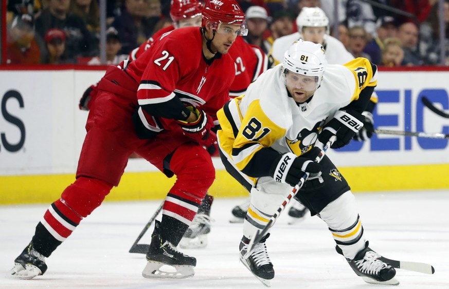 Pittsburgh Penguins&#039; Phil Kessel (81) battles with Carolina Hurricanes&#039; Nino Niederreiter (21) during the second period of an NHL hockey game, Tuesday, March 19, 2019, in Raleigh, N.C. (AP P ...