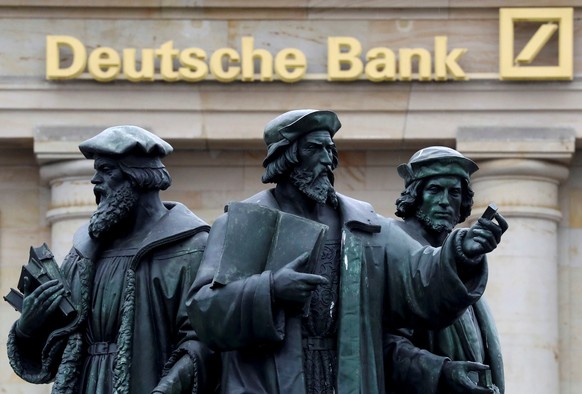 FILE PHOTO - A statue is pictured next to the logo of Germany&#039;s Deutsche Bank in Frankfurt, Germany September 30, 2016. REUTERS/Kai Pfaffenbach/File Photo GLOBAL BUSINESS WEEK AHEAD PACKAGE - SEA ...