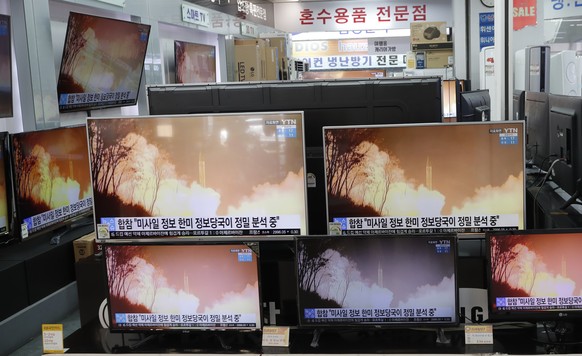 TV screens showi a news program reporting about North Korea&#039;s missiles with file footage at an electronic shop in Seoul, South Korea, Thursday, March 25, 2021. North Korea on Thursday test-fired  ...