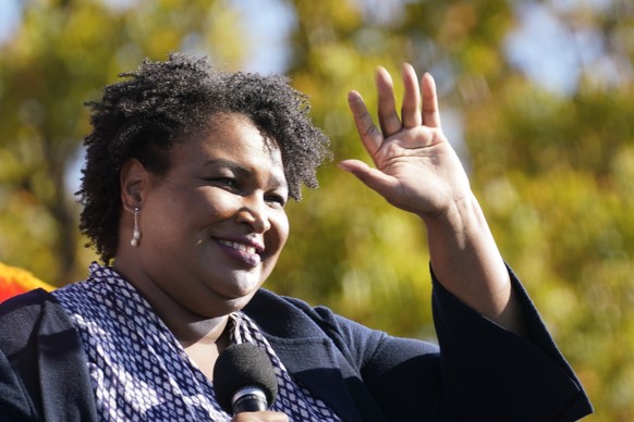 Stacey Abrams speaks to Biden supporters as they wait for former President Barack Obama to arrive and speak at a rally as he campaigns for Democratic presidential candidate former Vice President Joe B ...