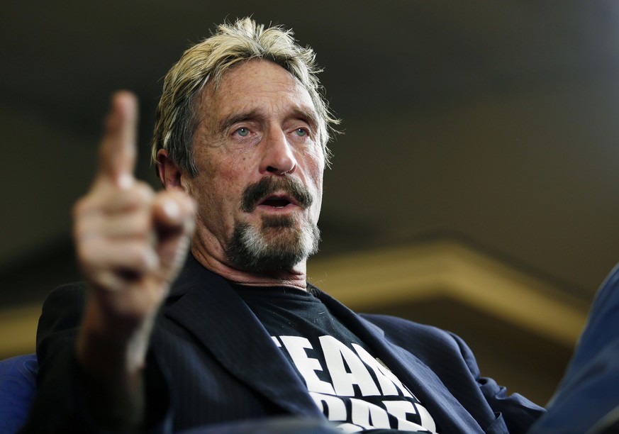 FILE - In this Sept. 9, 2015, file photo, internet security pioneer John McAfee announces his candidacy for president in Opelika, Ala. McAfee has been charged with evading taxes after failing to repor ...