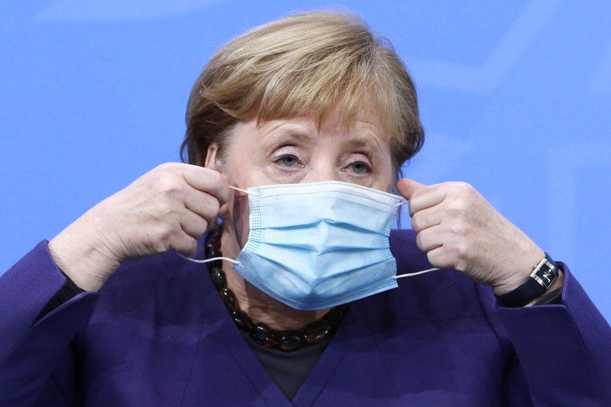 epa08857909 German Chancellor Angela Merkel attends a press conference after German Chancellor Merkel&#039;s video conference with German State Premiers about Coronavirus measures, in Berlin, Germany, ...