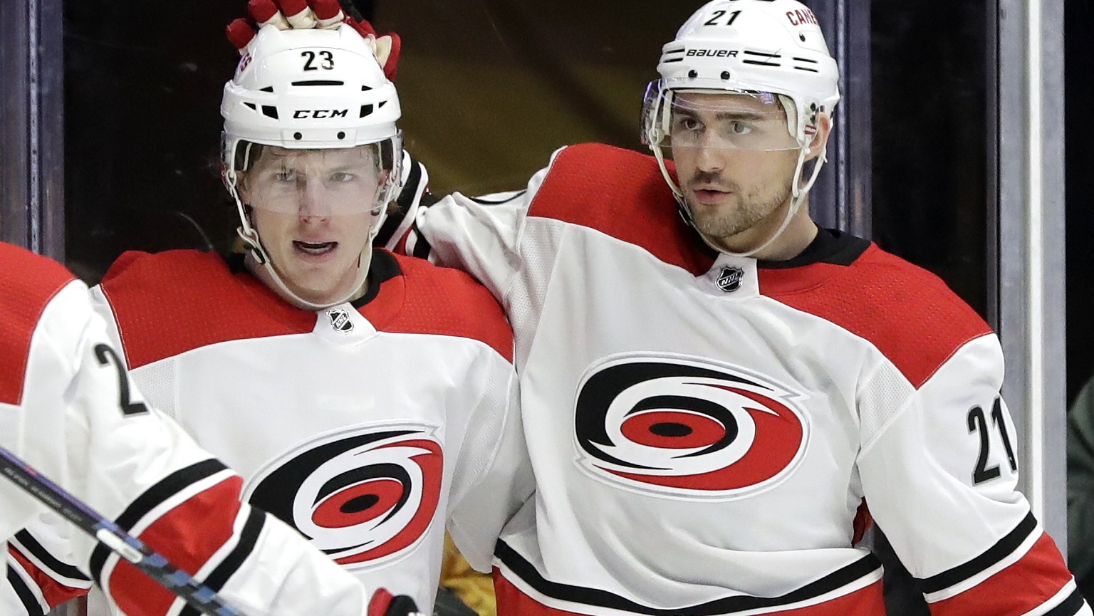 Carolina Hurricanes right wing Nino Niederreiter (21), of Switzerland, celebrates with Brock McGinn (23) and Sebastian Aho (20), of Finland, after Niederreiter scored a goal against the Nashville Pred ...