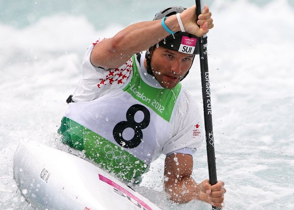 epa03333053 Mike Kurt of Switzerland competes in the Kayak Single (K1) Men&#039;s race during the London 2012 Olympic Games Canoe Slalom competition at the Lee Valley White Water Centre, Waltham Cross ...