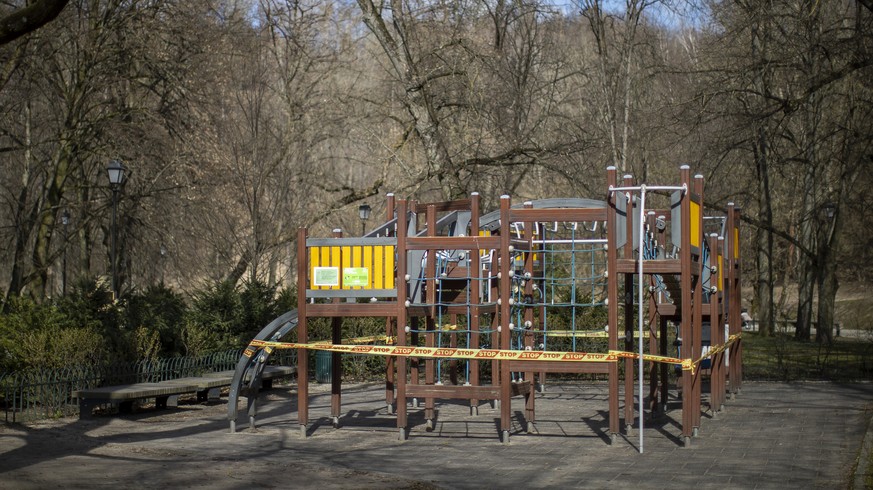 An empty children&#039;s playground after the government banned its usage due to the outbreak of the coronavirus, in Vilnius, Lithuania, Tuesday, March 31, 2020. All public and private events are bann ...