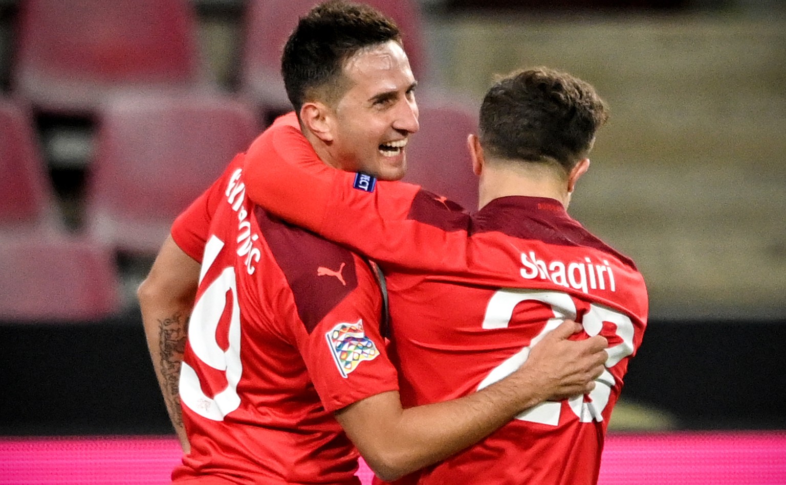 epa08741617 Switzerland&#039;s Mario Gavranovic (L) celebrates with his teammate Xherdan Shaqiri (R) after scoring the 1-0 lead during the UEFA Nations League group stage, league A, group 4 soccer mat ...