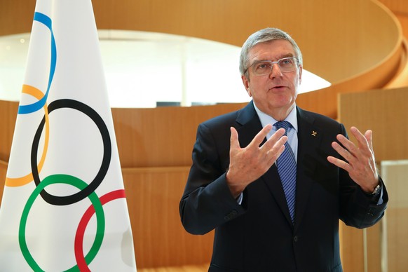 FILE - In this March 25, 2020, file photo, Thomas Bach, president of the International Olympic Committee (IOC), attends an interview after the decision to postpone the Tokyo 2020 Olympic Games because ...
