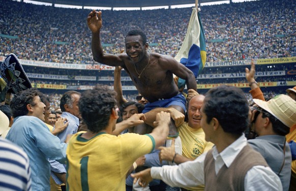 FILE - In this June 21, 1970 file photo, Brazil&#039;s Pele is hoisted on shoulders of his teammates after Brazil won the World Cup final against Italy, 4-1, in Mexico City&#039;s Estadio Azteca. With ...