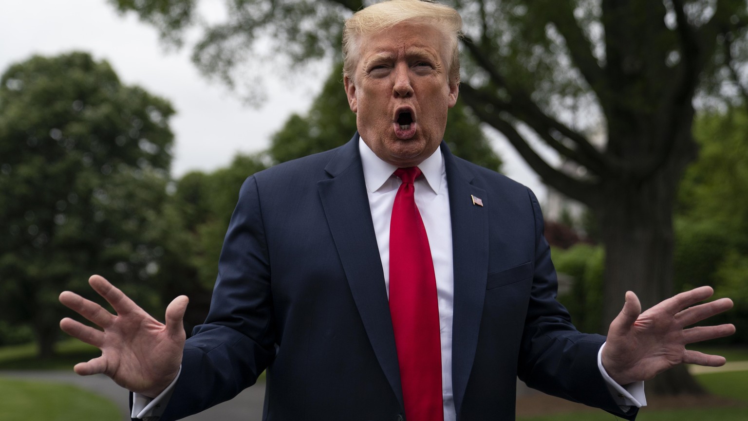 President Donald Trump talks to reporters before departing the White House for a trip to Michigan, Thursday, May 21, 2020, in Washington. (AP Photo/Evan Vucci)
Donald Trump