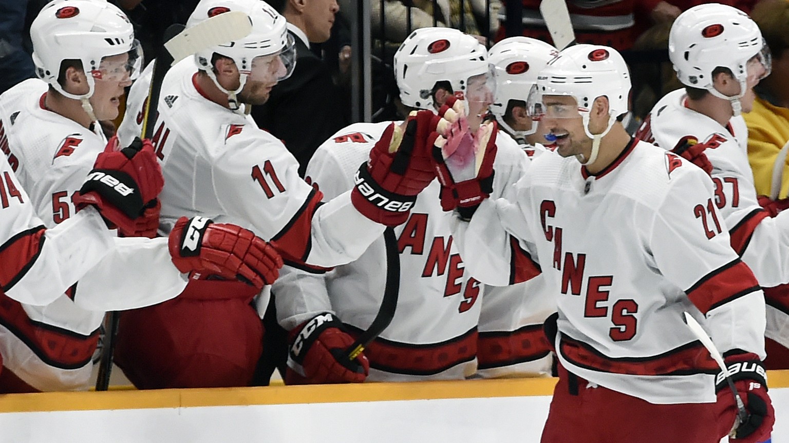 Carolina Hurricanes right wing Nino Niederreiter (21), of Switzerland, is congratulated after scoring a goal against the Nashville Predators during the second period of an NHL hockey game Tuesday, Feb ...
