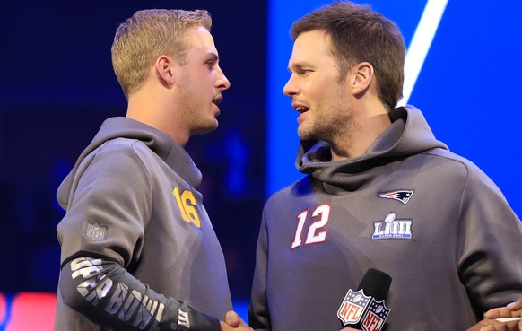 epa07328542 Los Angeles Rams Quarterback Jared Goff (L) and New England Patriots quarterback Tom Brady (R) shake hands between the two sessions of the National Football League&#039;s Super Bowl LIII O ...