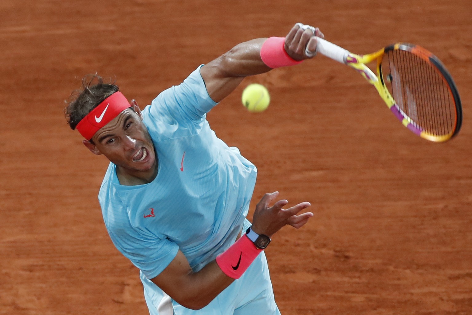 FILE - In this Oct. 11, 2020, file photo, Spain&#039;s Rafael Nadal serves against Serbia&#039;s Novak Djokovic in the final match of the French Open tennis tournament at the Roland Garros stadium in  ...