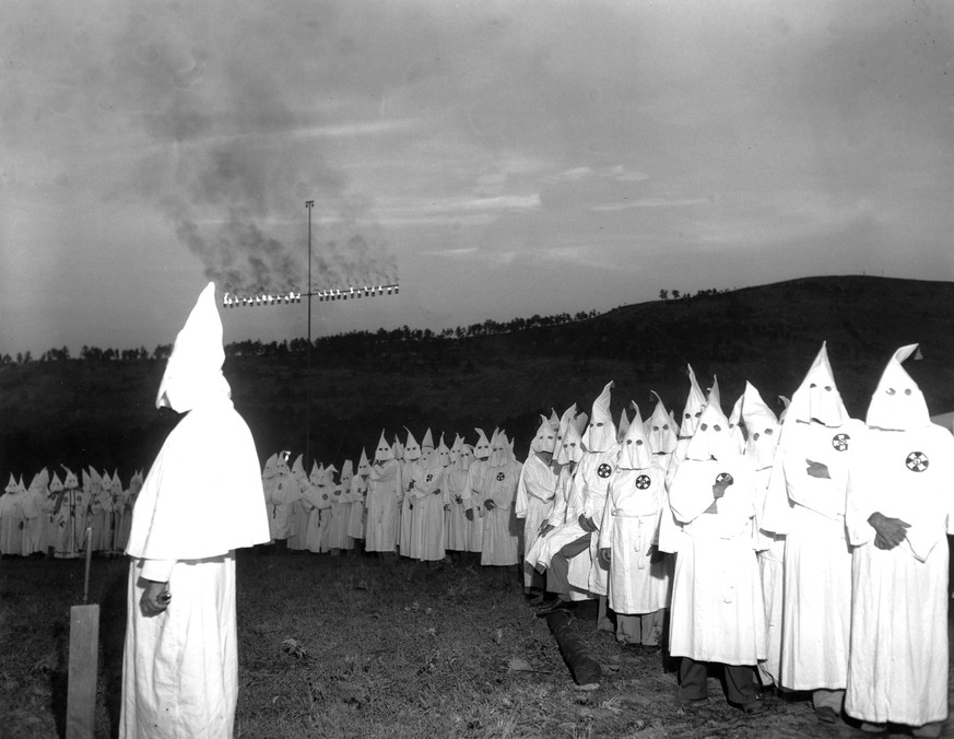 FILE- In this July 23, 1948 file photo the Ku Klux Klan burns a huge cross atop Stone Mountain, near Atlanta, Ga., while initiating 700 new members. Stone Mountain’s history is deeply entwined with th ...