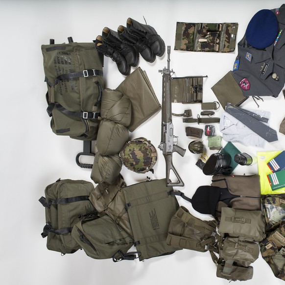 The personal equipment of a soldier of the Swiss Armed Forces, pictured on February 12, 2014, in Hinwil, Switzerland. At the top, there are various bags, from left: belongings bag, transport bag with  ...