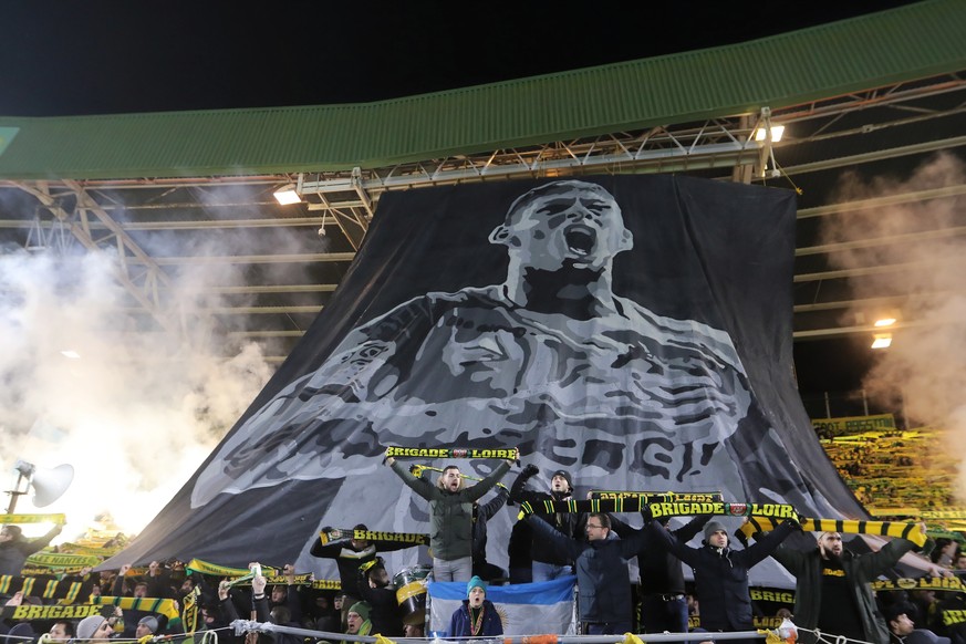 epa07332404 FC Nantes supporters display a banner in tribute for Argentinian soccer player Emiliano Sala, who went missing on 21 January 2019 after a light aicraft he was travelling in from Nantes to  ...